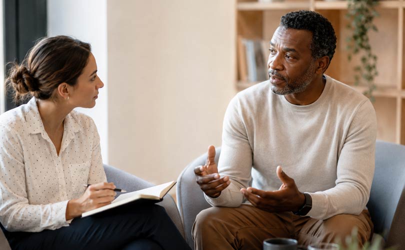 Leadership mentor discussing professional development with a mentee